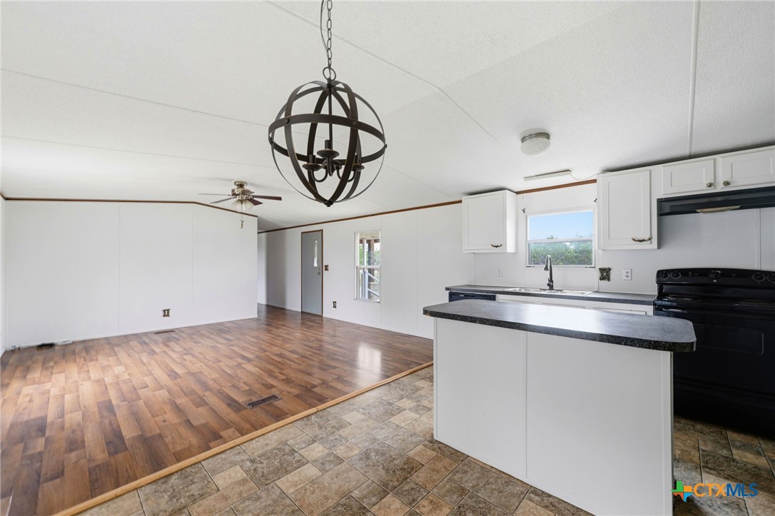 770 Private Road 3447 Kempner, TX 76539 - Photo 13 of 34 a kitchen with stainless steel appliances granite countertop a sink and cabinets