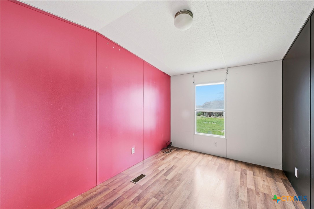 770 Private Road 3447 Kempner, TX 76539 - Photo 14 of 34 an empty room with a window