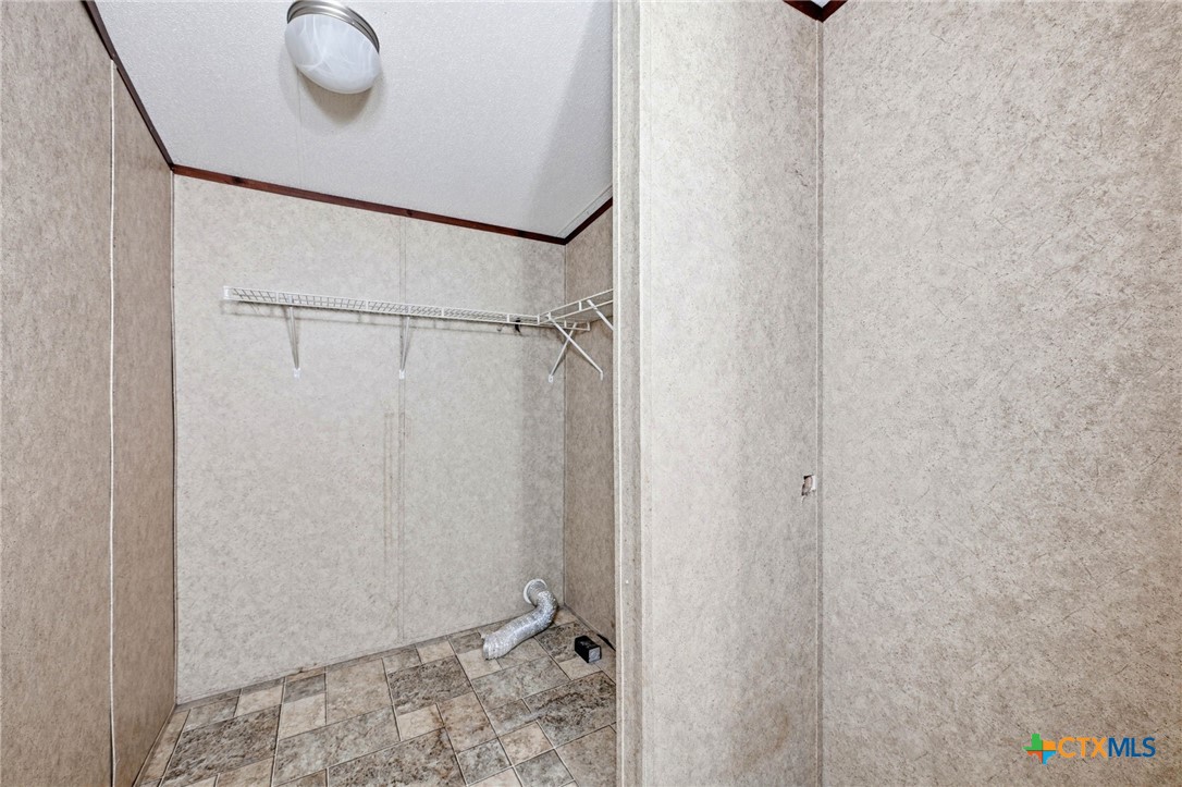 770 Private Road 3447 Kempner, TX 76539 - Photo 18 of 34 a bathroom with a shower and a sink