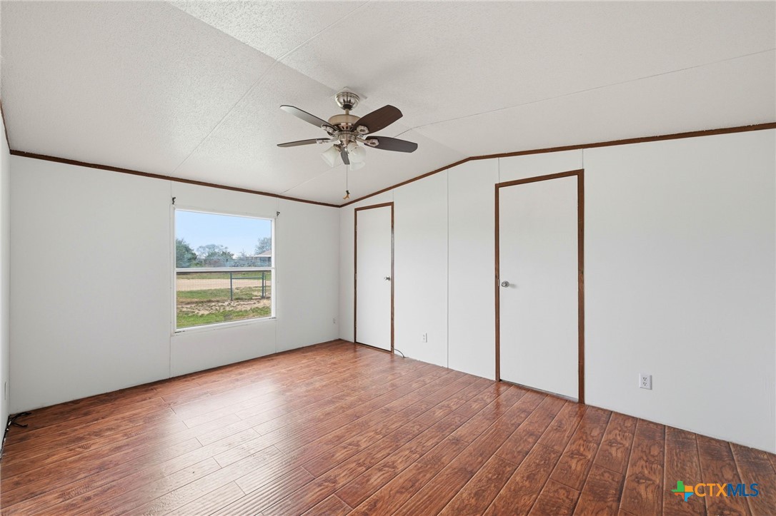 770 Private Road 3447 Kempner, TX 76539 - Photo 19 of 34 a view of an empty room with a window and wooden floor
