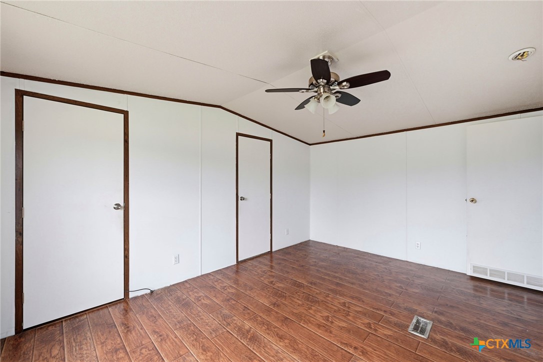 770 Private Road 3447 Kempner, TX 76539 - Photo 20 of 34 a view of a big room with wooden floor and fan