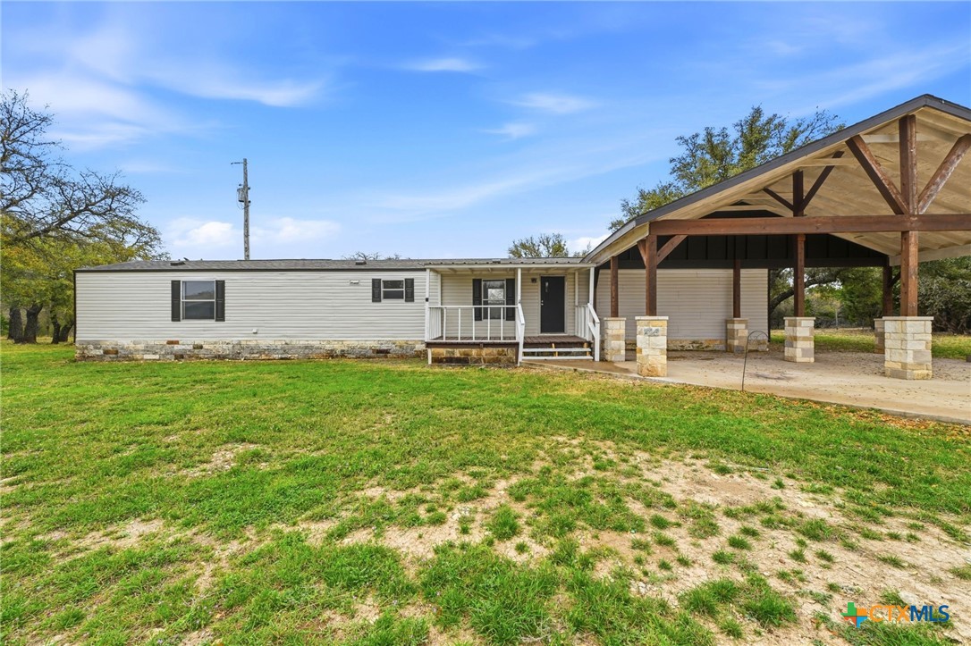 770 Private Road 3447 Kempner, TX 76539 - Photo 2 of 34 a backyard of a house with table and chairs