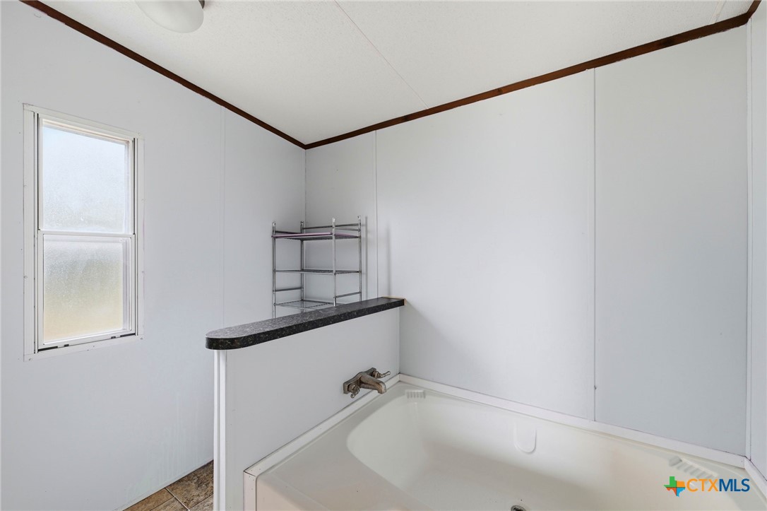 770 Private Road 3447 Kempner, TX 76539 - Photo 23 of 34 a bathroom with a sink and a shower