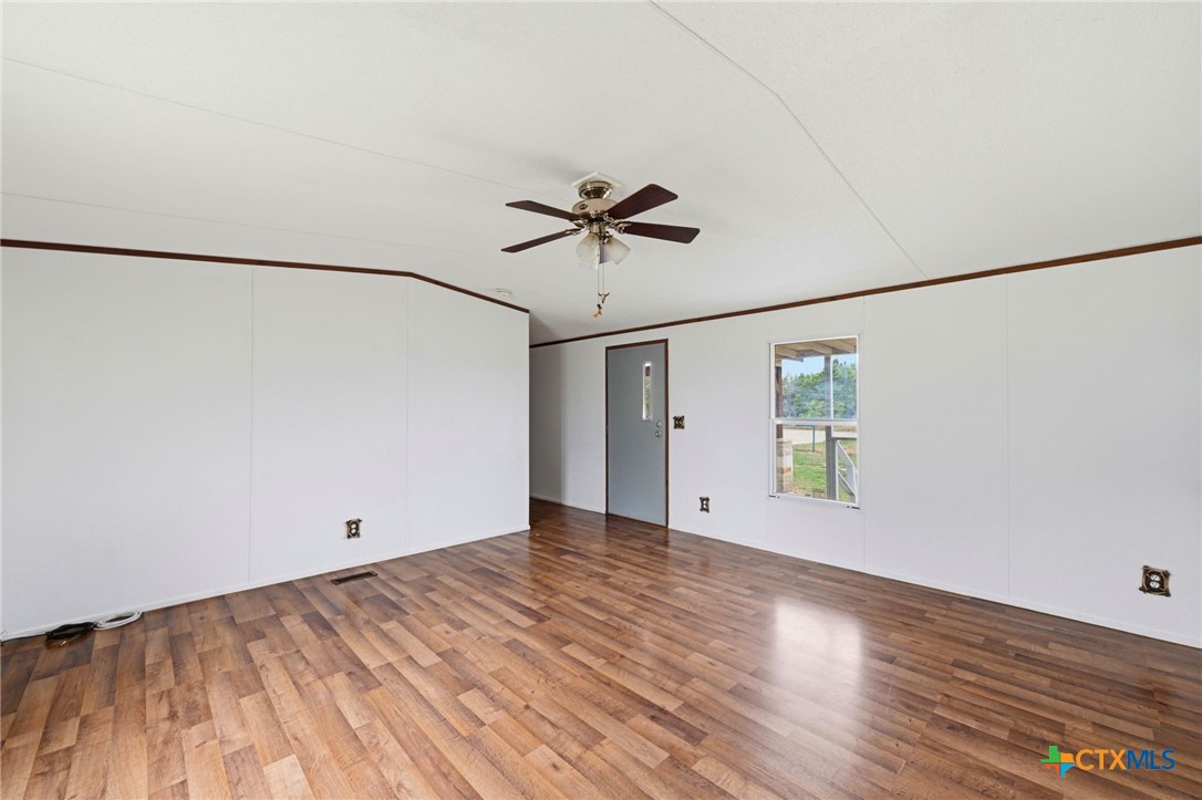 770 Private Road 3447 Kempner, TX 76539 - Photo 5 of 34 a view of an empty room with a window and a ceiling fan