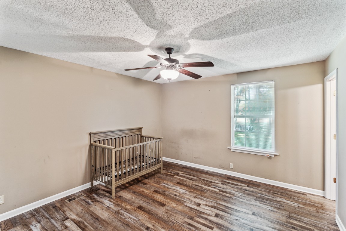 771 Needmore Road Clarksville, TN 37040 - Photo 12 of 15 an empty room with windows and fan