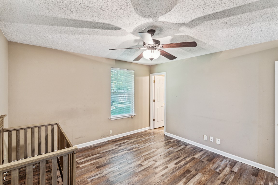 771 Needmore Road Clarksville, TN 37040 - Photo 13 of 15 a view of an empty room with window and wooden floor