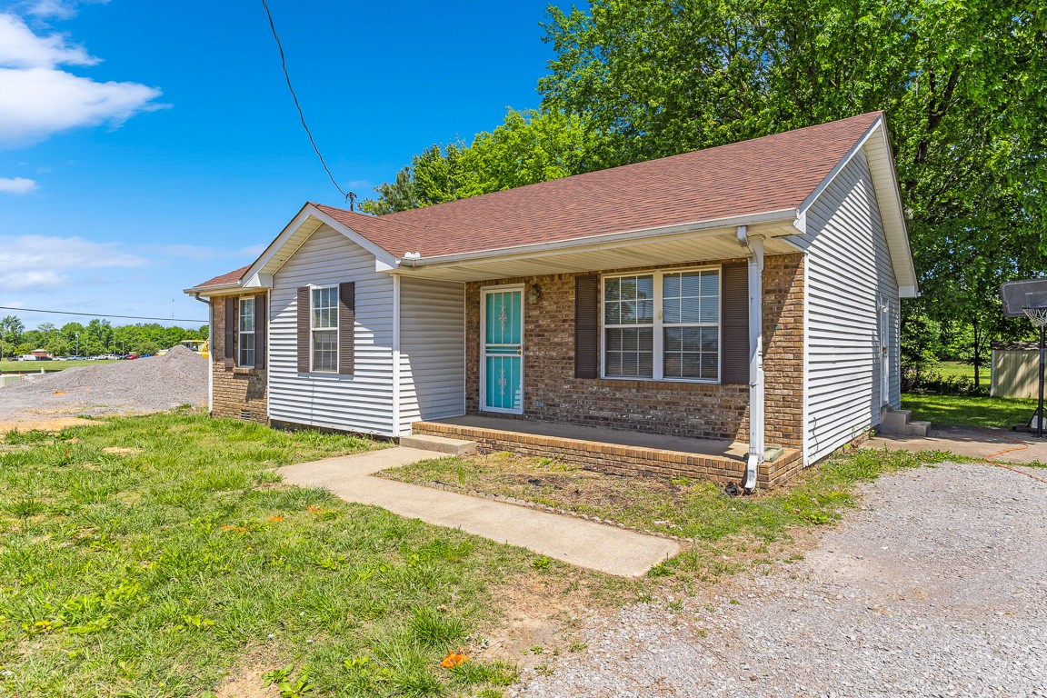 771 Needmore Road Clarksville, TN 37040 - Photo 2 of 15 a front view of a house with garden