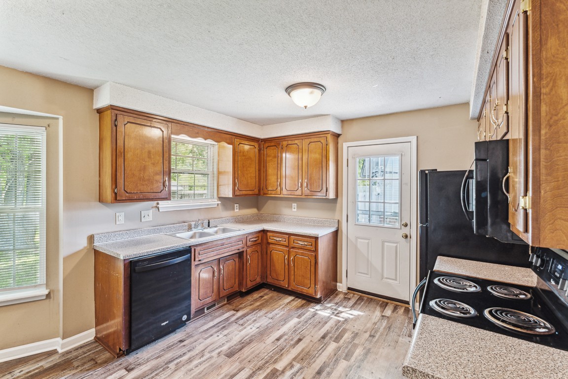 771 Needmore Road Clarksville, TN 37040 - Photo 6 of 15 a kitchen with a sink stove and refrigerator