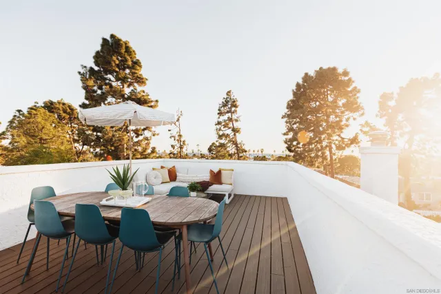 a view of deck with chairs and wooden floor
