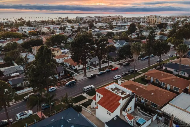 a bedroom with a large bed and a large window