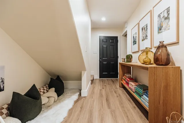 a view of a dining room with furniture and wooden floor
