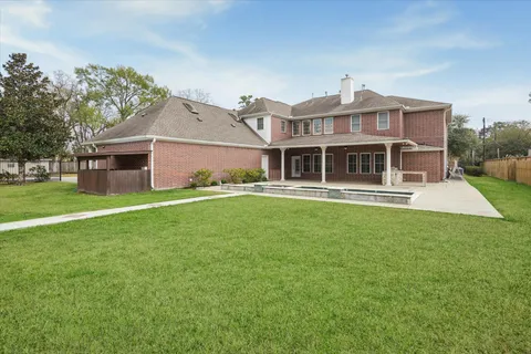 a front view of a house with a yard table and chairs