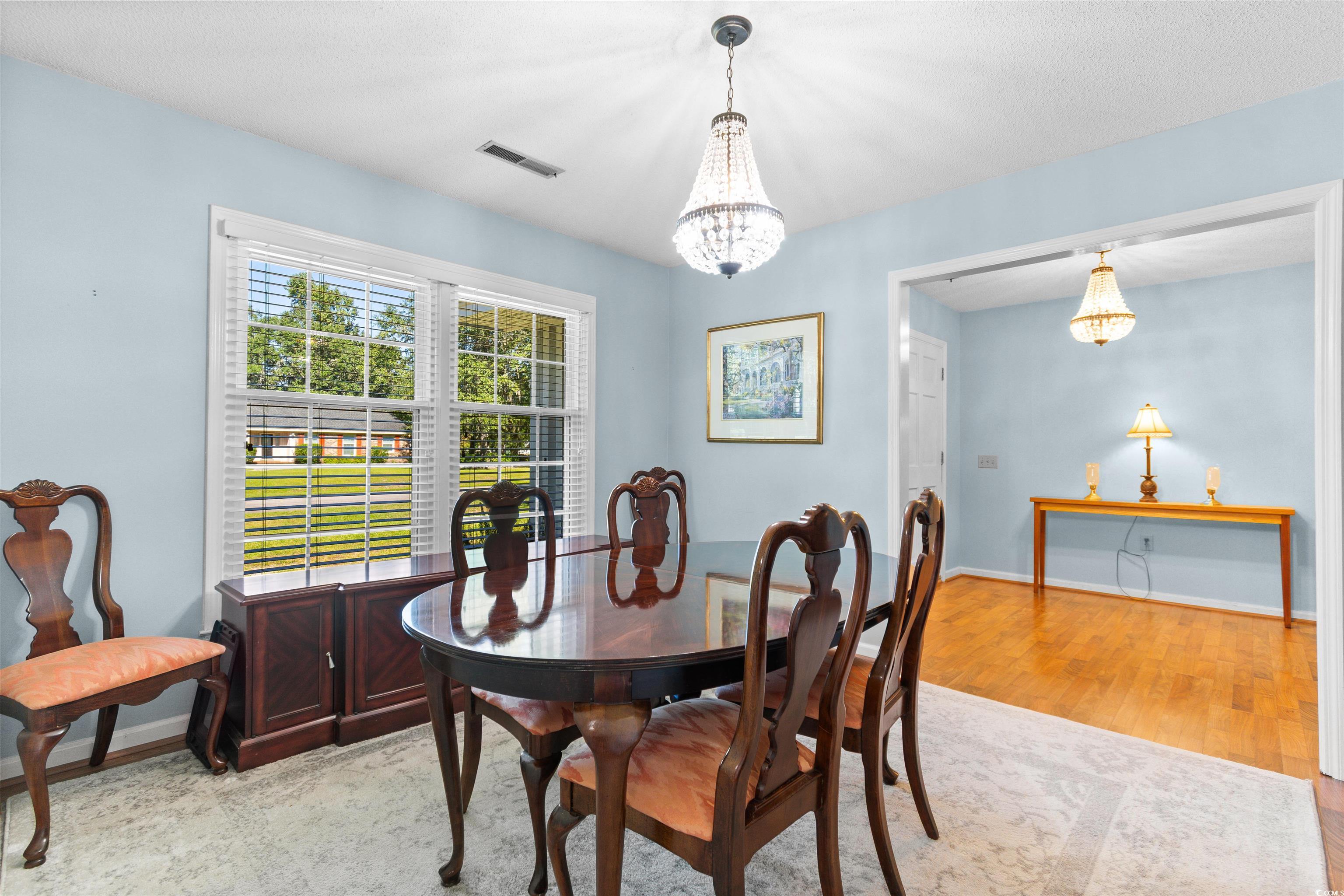 814 2nd Avenue Georgetown, SC 29440 - Photo 11 of 39 Dining space with wood finished floors and a chandelier