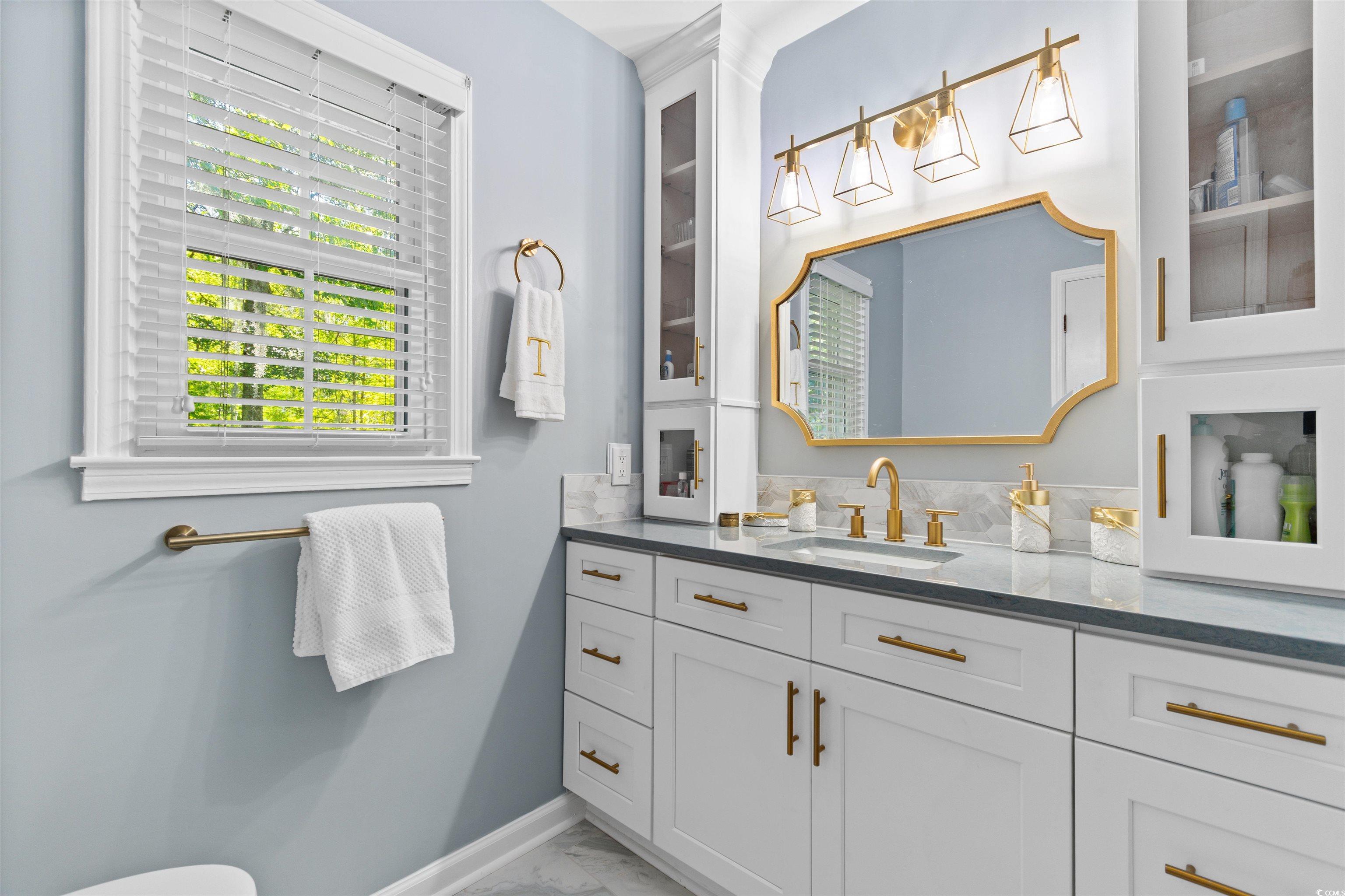 814 2nd Avenue Georgetown, SC 29440 - Photo 20 of 39 Bathroom with vanity and a marble finish shower