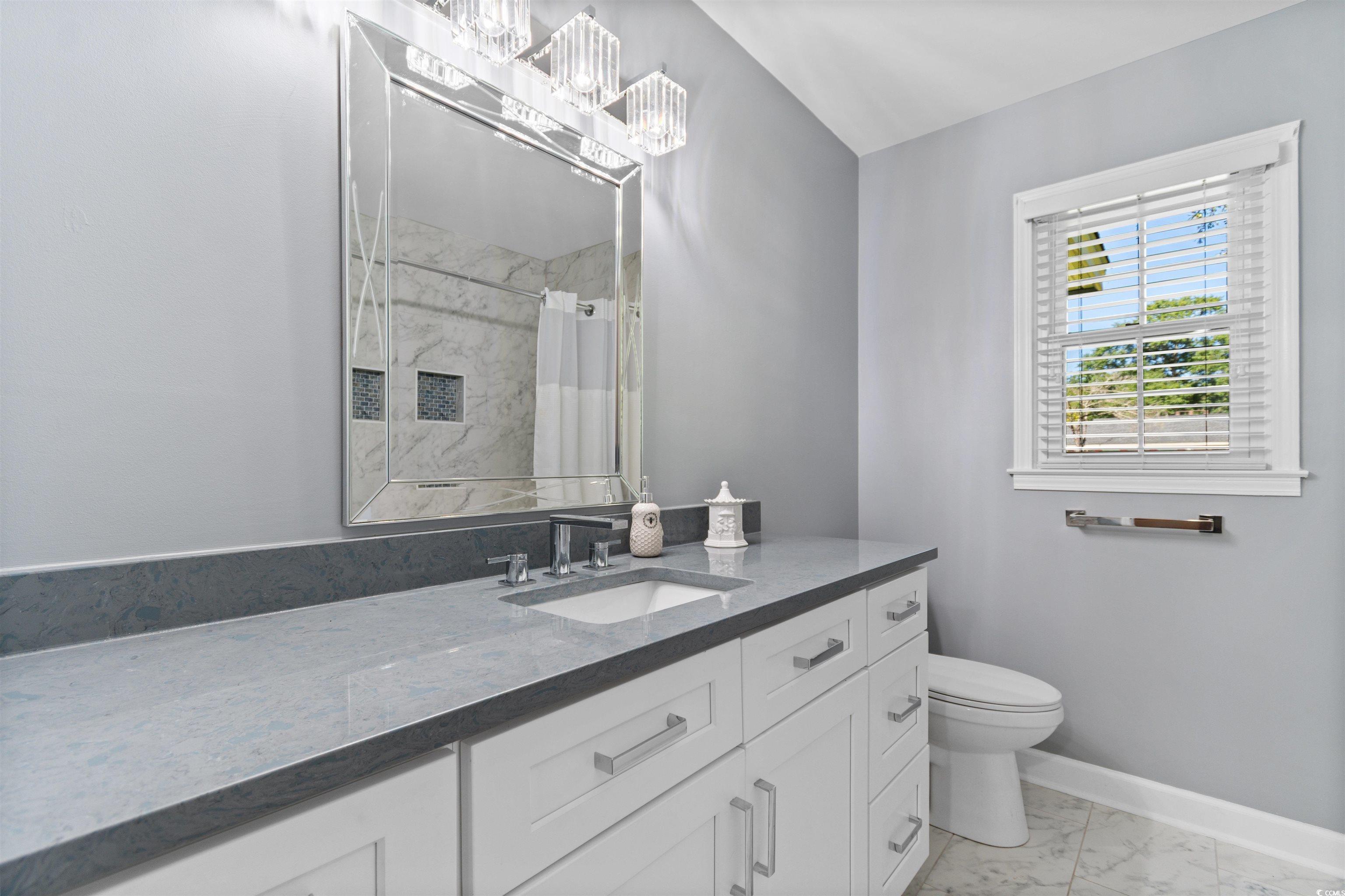 814 2nd Avenue Georgetown, SC 29440 - Photo 24 of 39 Bedroom featuring dark wood-style flooring, a textured ceiling, and ceiling fan