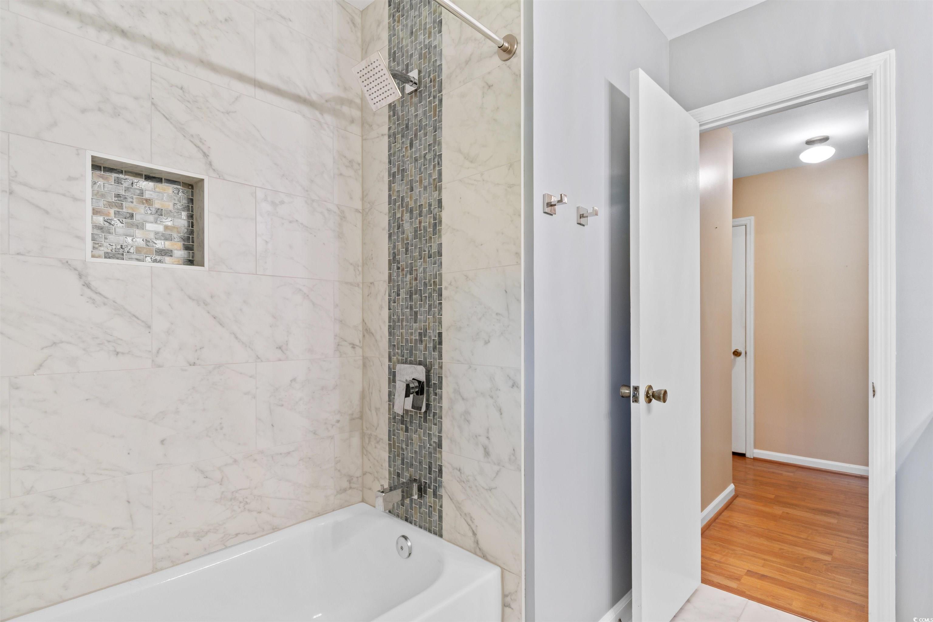 814 2nd Avenue Georgetown, SC 29440 - Photo 25 of 39 Full bath featuring vanity, a shower with shower curtain, and light marble finish flooring