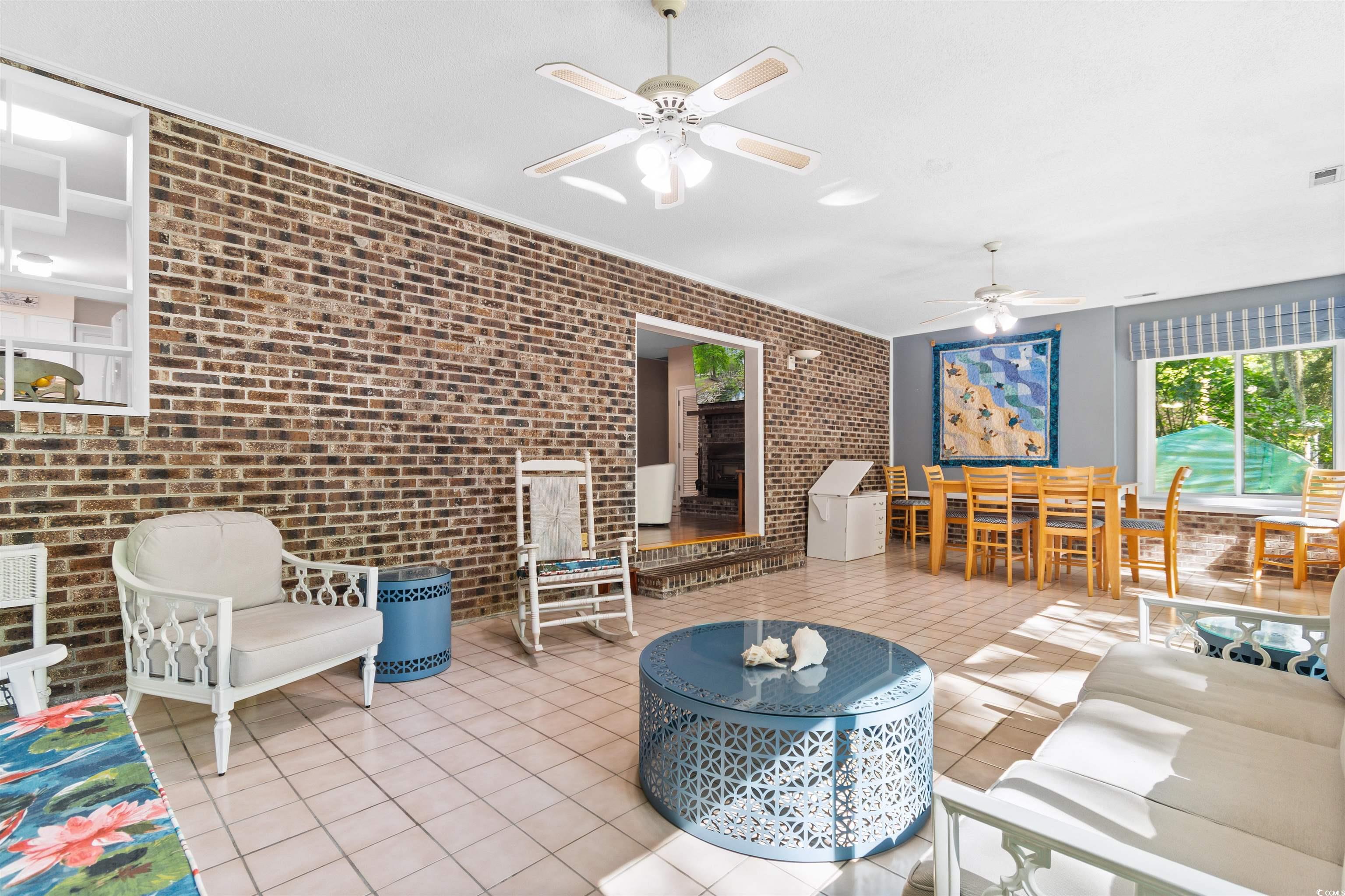 814 2nd Avenue Georgetown, SC 29440 - Photo 27 of 39 Sunroom with outdoor dining area, an outdoor hangout area, and ceiling fan