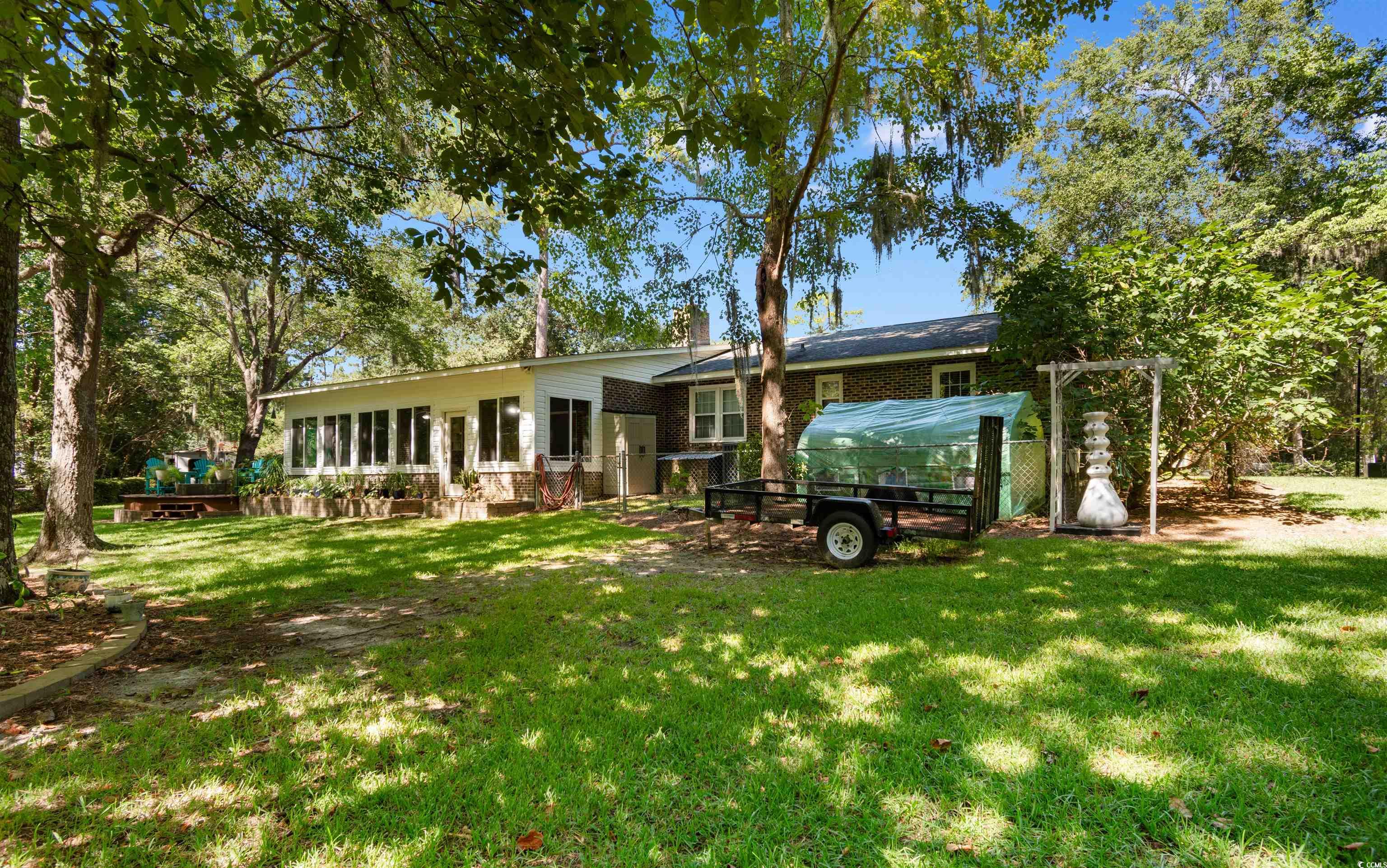 814 2nd Avenue Georgetown, SC 29440 - Photo 32 of 39 Back of property with a yard, brick siding, and a patio area