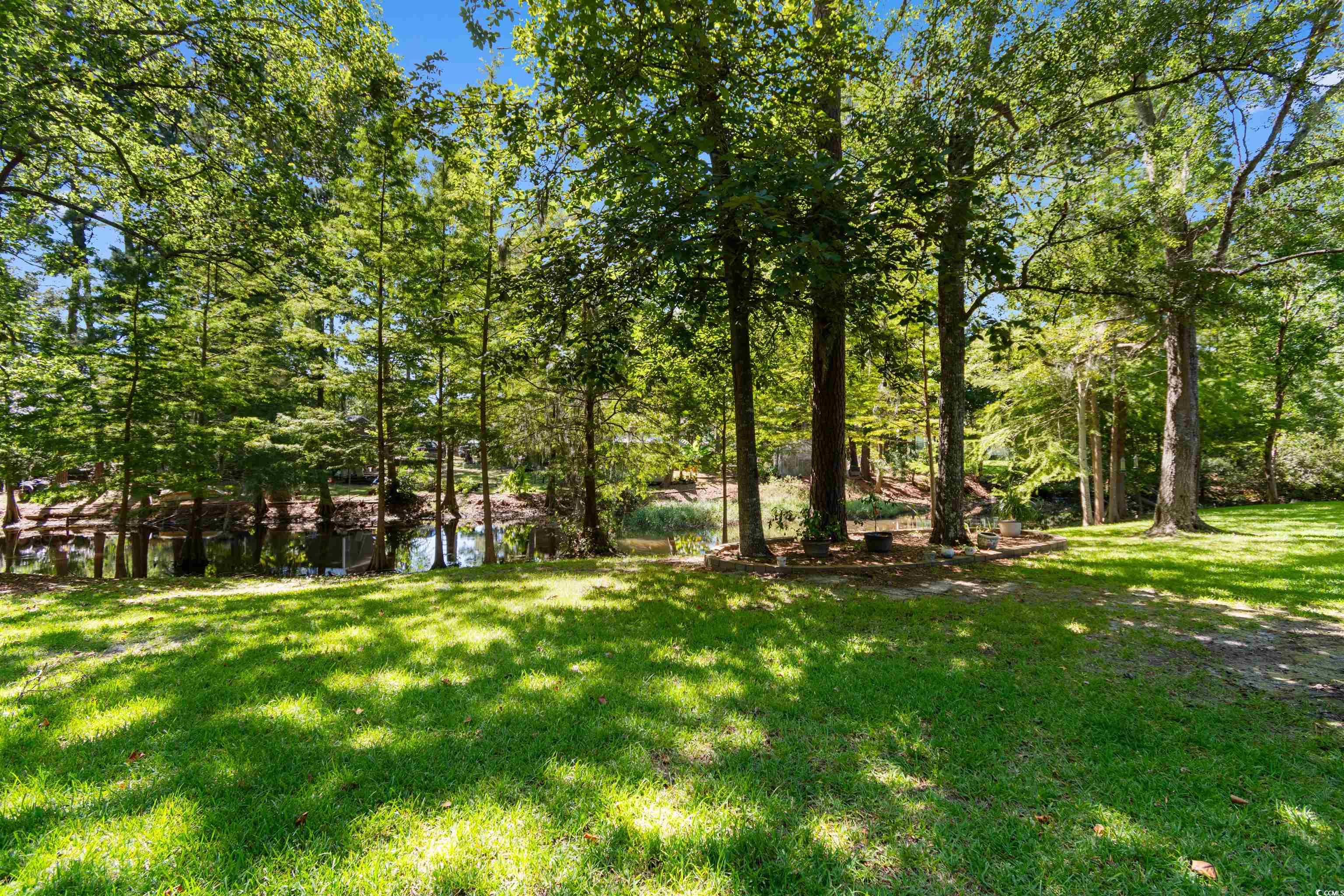 814 2nd Avenue Georgetown, SC 29440 - Photo 33 of 39 Back of house featuring a lawn, a deck, and brick siding