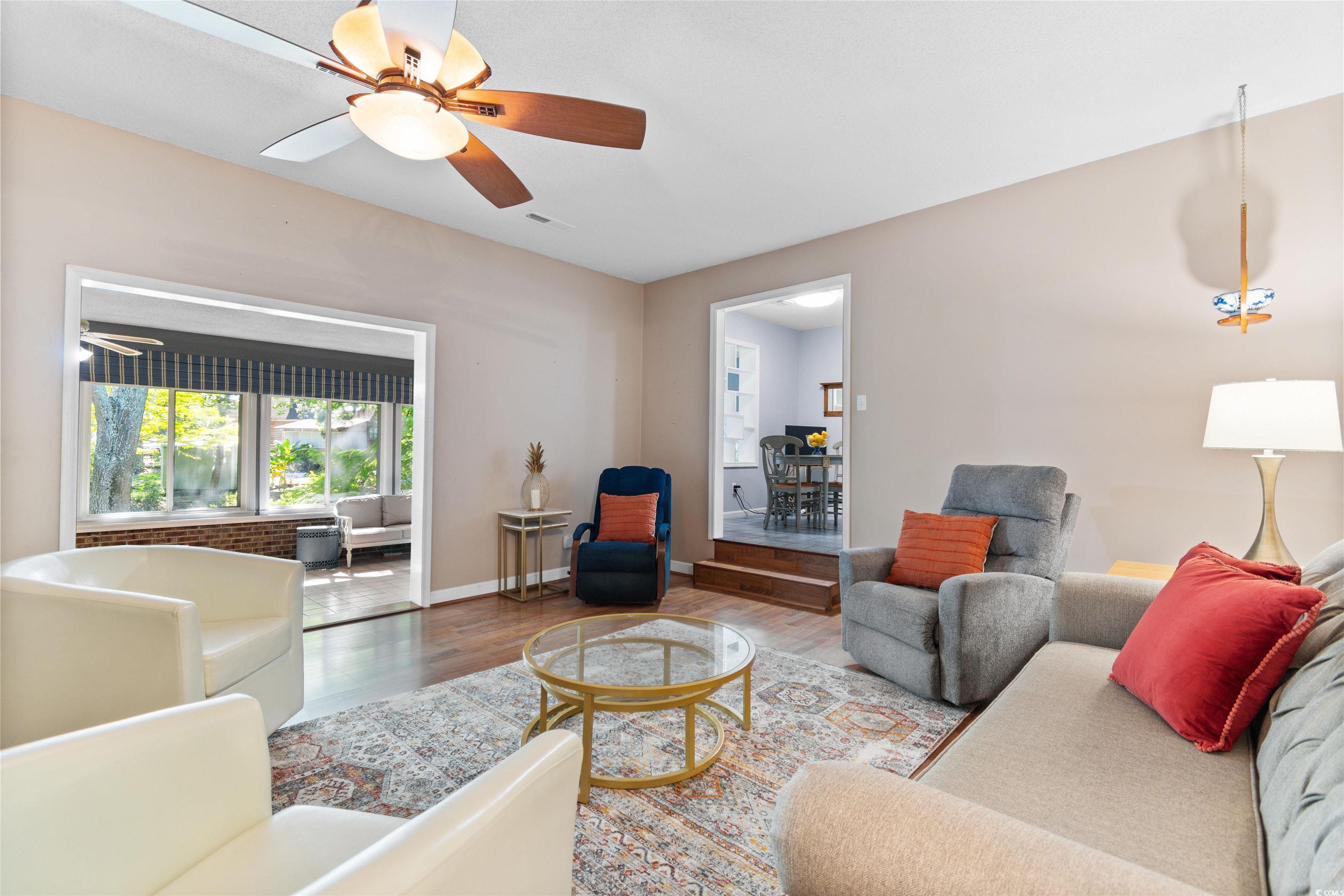 814 2nd Avenue Georgetown, SC 29440 - Photo 7 of 39 Living area featuring wood finished floors and a ceiling fan