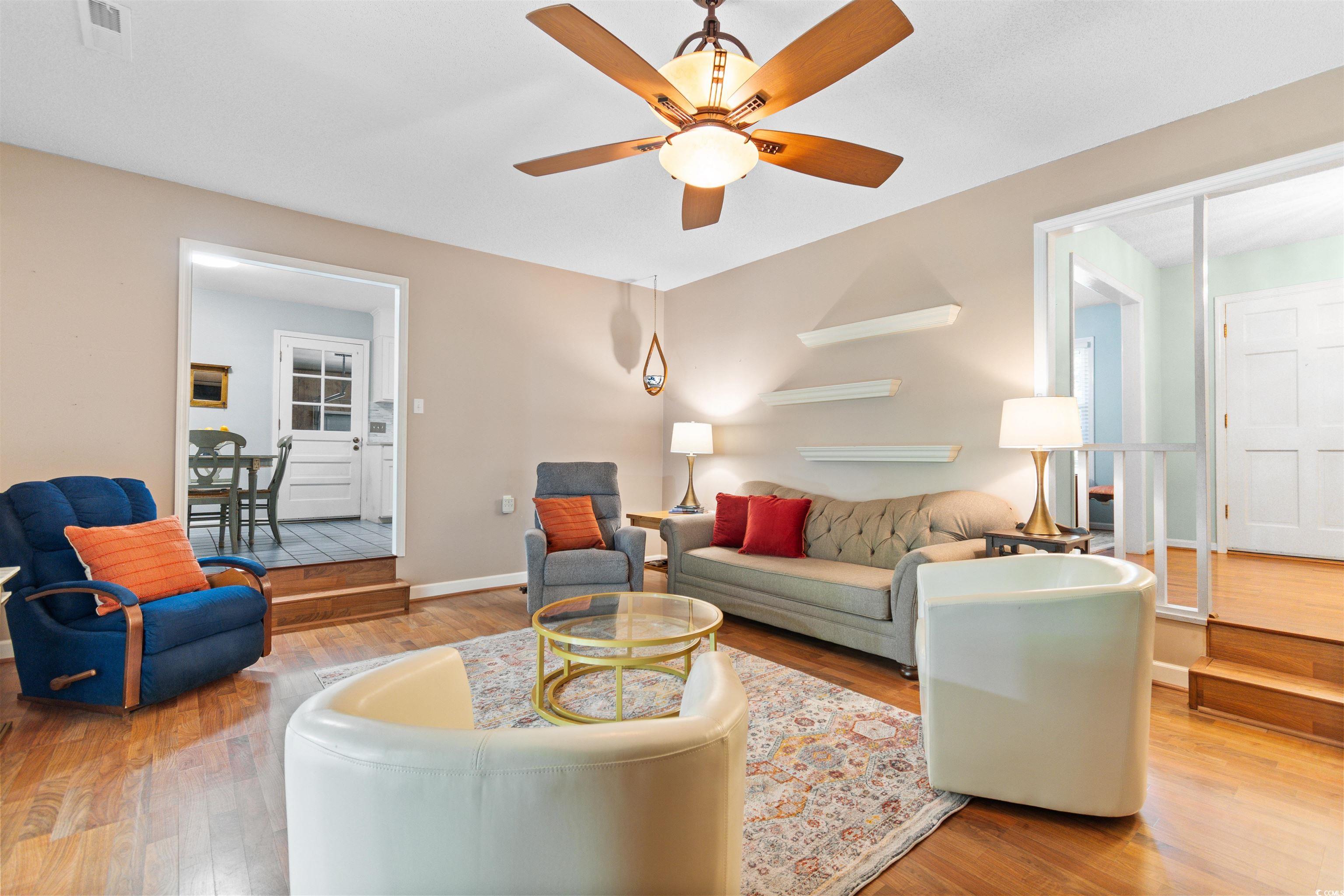 814 2nd Avenue Georgetown, SC 29440 - Photo 8 of 39 Living room featuring light wood-type flooring and ceiling fan