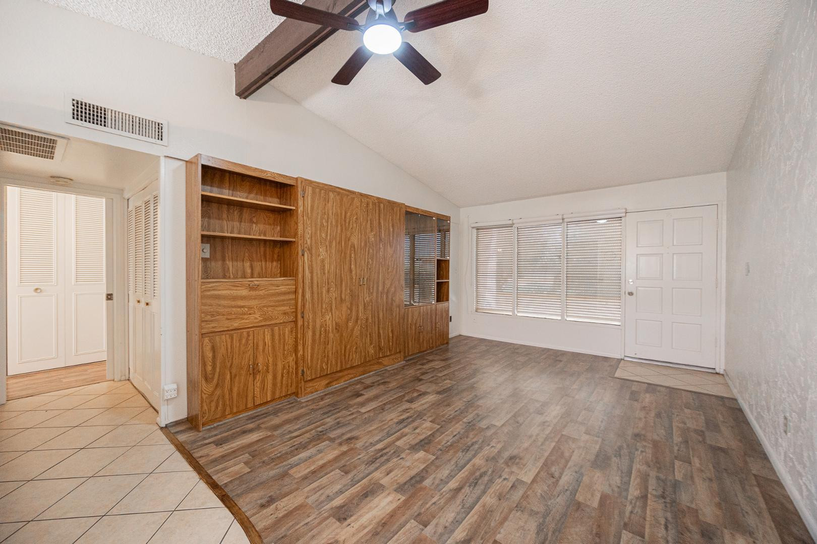 609 South Power Road, Unit 338 Mesa, AZ 85206 - Photo 5 of 24 wooden floor in an empty room with a window