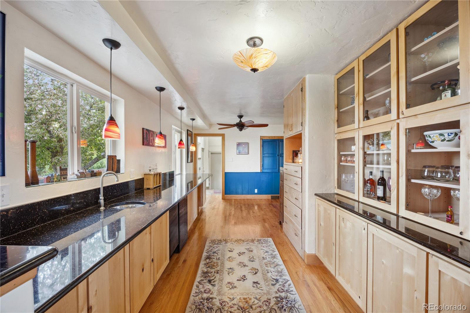 1069 Crestmoor Drive Boulder, CO 80303 - Photo 14 of 45 a hallway with a large window and furniture