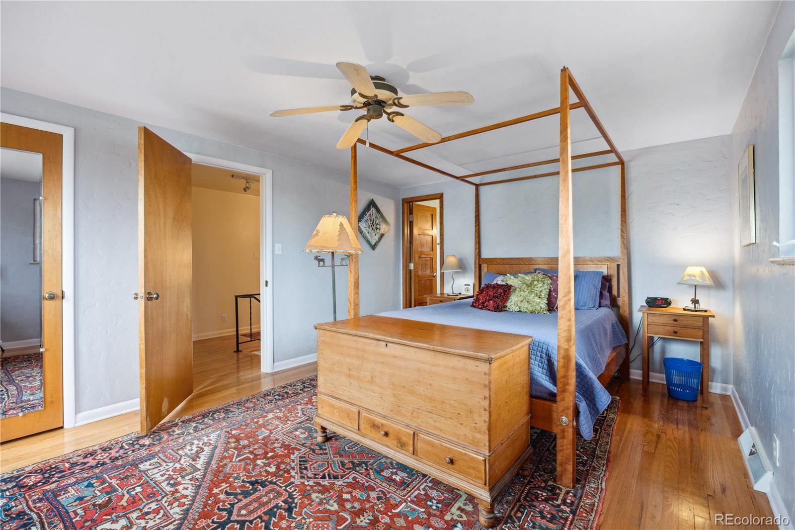 1069 Crestmoor Drive Boulder, CO 80303 - Photo 16 of 45 a bed room with a bed and wooden floor