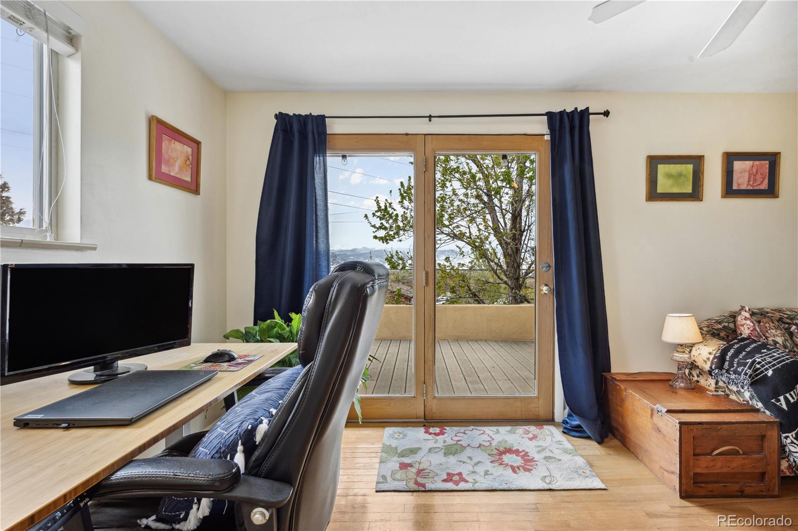 1069 Crestmoor Drive Boulder, CO 80303 - Photo 20 of 45 a view of a workspace with furniture and a window