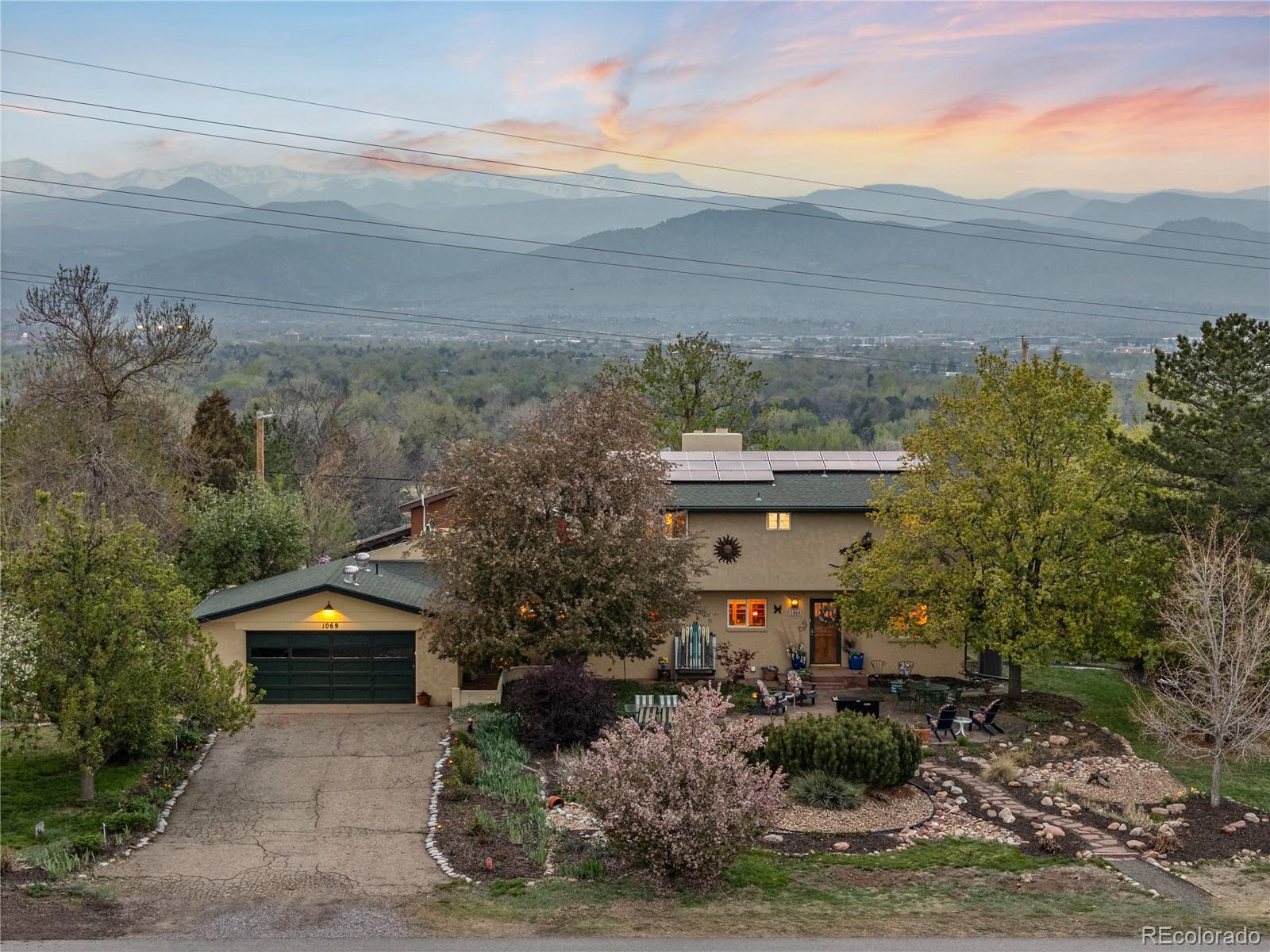 1069 Crestmoor Drive Boulder, CO 80303 - Photo 37 of 45 a front view of house with yard and mountain view in back