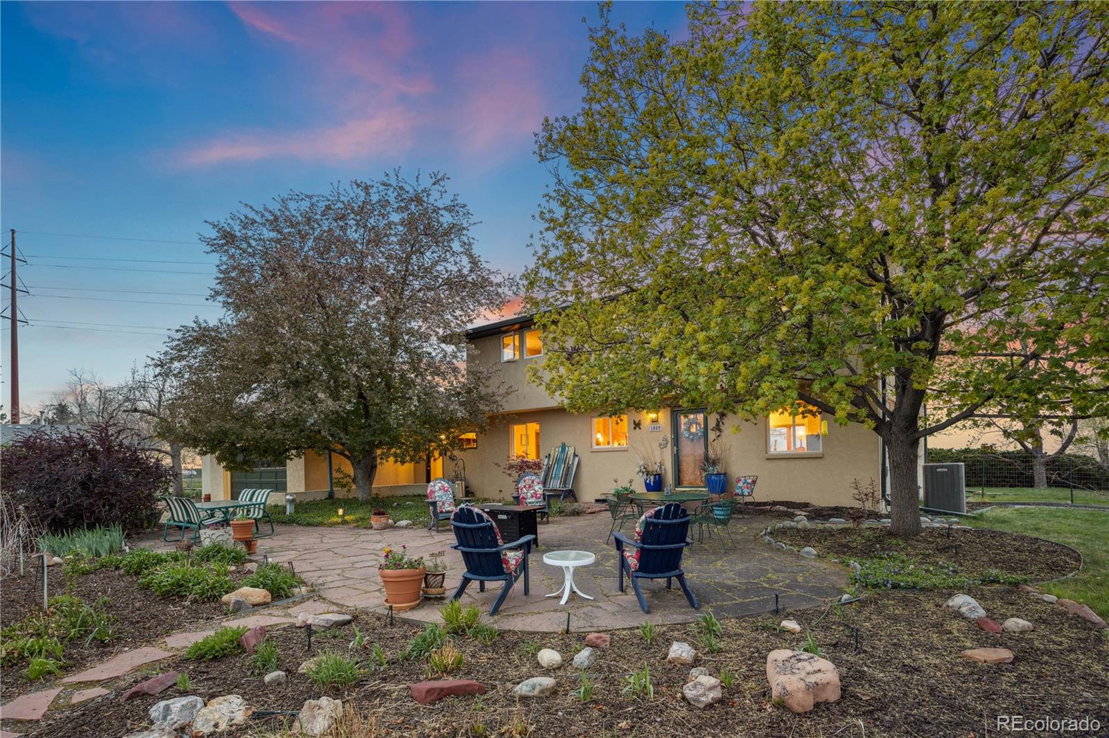 1069 Crestmoor Drive Boulder, CO 80303 - Photo 42 of 45 a view of a patio with chairs and a large tree