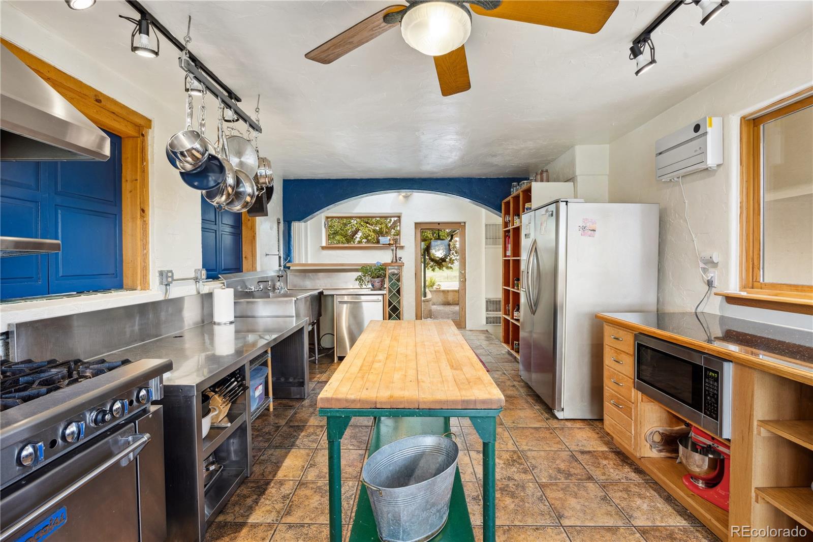 1069 Crestmoor Drive Boulder, CO 80303 - Photo 5 of 45 a kitchen with stainless steel appliances granite countertop a stove and a refrigerator