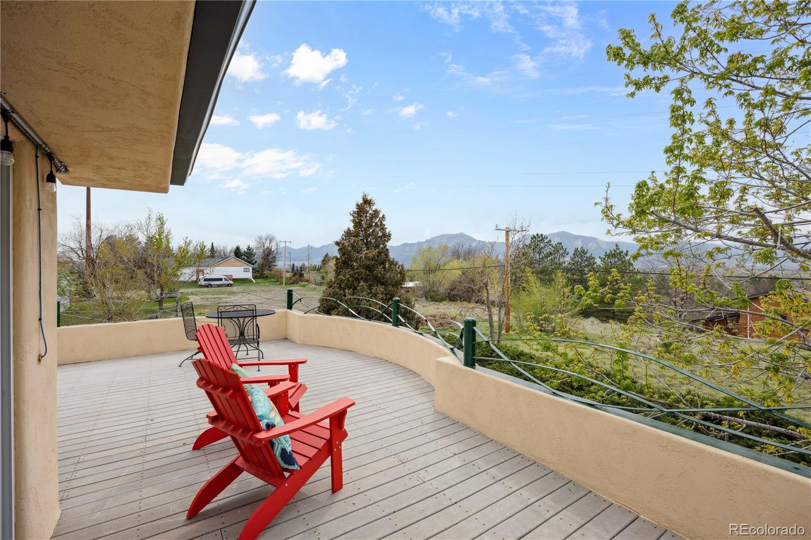 1069 Crestmoor Drive Boulder, CO 80303 - Photo 9 of 45 a view of a chairs and table in the balcony