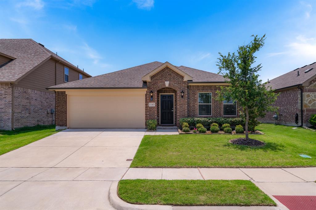 1145 Sheldon Drive Anna, TX 75409 - Photo 1 of 1 a front view of a house with a yard and garage