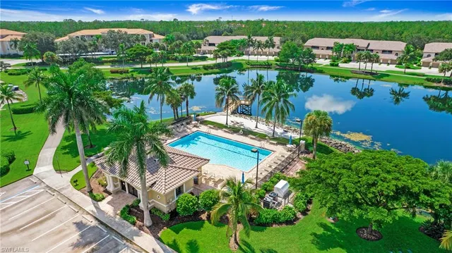 an aerial view of a house with a lake view