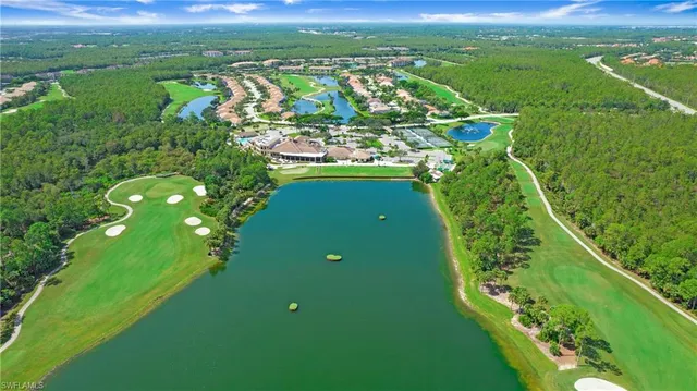an aerial view of a house with outdoor space swimming pool