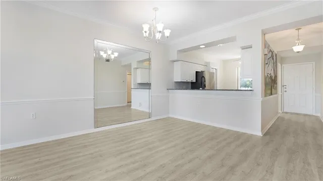 wooden floor in an empty room with a mirror