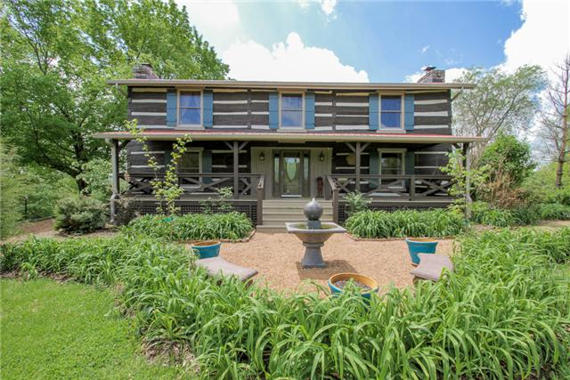 an aerial view of a house with garden and plants