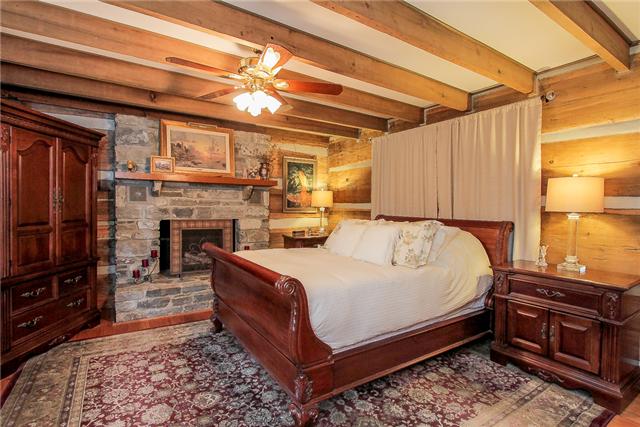 2281 Osburn Road Arrington, TN 37014 - Photo 15 of 20 a bed room with a bed and a fireplace