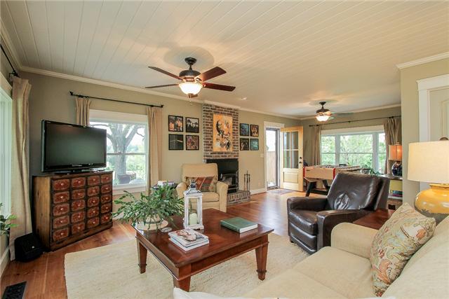 2281 Osburn Road Arrington, TN 37014 - Photo 3 of 20 a living room with furniture a flat screen tv and a large window
