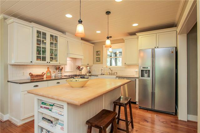 2281 Osburn Road Arrington, TN 37014 - Photo 6 of 20 a kitchen with a refrigerator a sink and a stove
