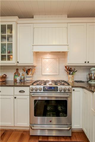 2281 Osburn Road Arrington, TN 37014 - Photo 7 of 20 a stove top oven sitting inside of a kitchen