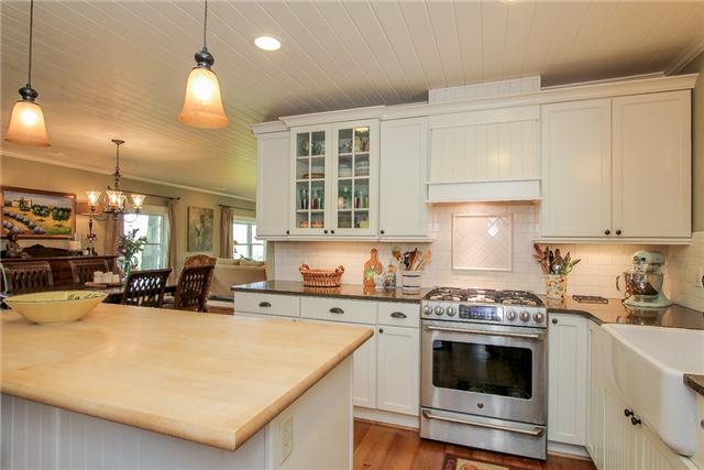 2281 Osburn Road Arrington, TN 37014 - Photo 8 of 20 a kitchen with a stove a sink and a refrigerator