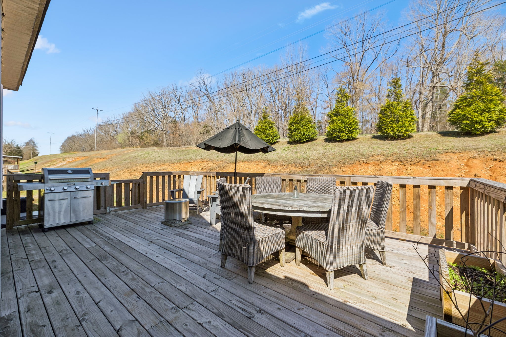 20 Sycamore Ridge West Burns, TN 37029 - Photo 33 of 38 a view of a chairs and table on the wooden deck