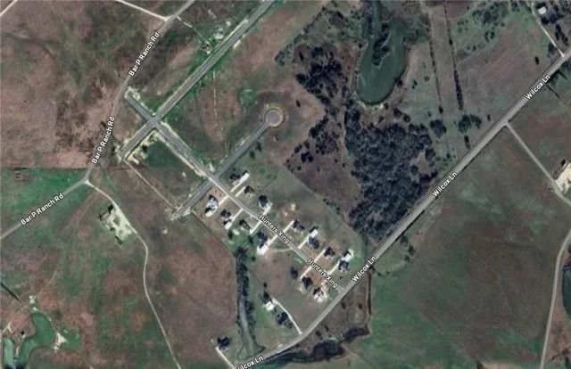 a aerial view of a house with a yard