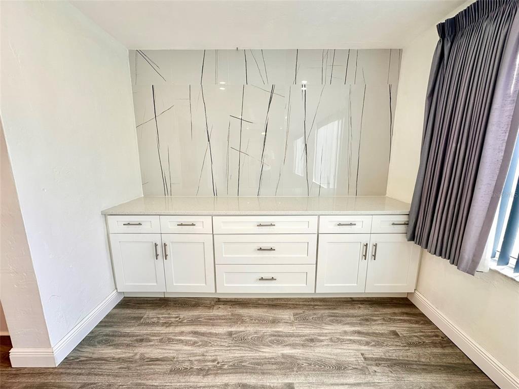 2431 Canadian Way, Unit 37 Clearwater, FL 33763 - Photo 15 of 46 a view of a kitchen with white cabinets