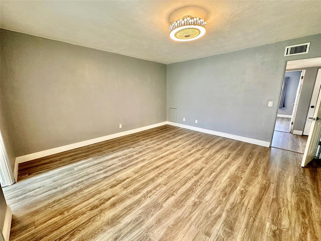 2431 Canadian Way, Unit 37 Clearwater, FL 33763 - Photo 16 of 46 a view of a room with wooden floor