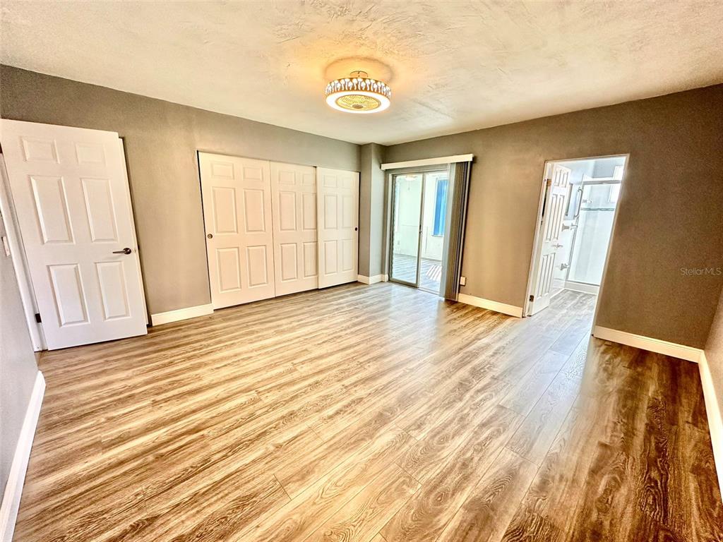 2431 Canadian Way, Unit 37 Clearwater, FL 33763 - Photo 18 of 46 a view of a room with wooden floor and stairs