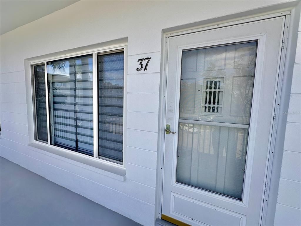 2431 Canadian Way, Unit 37 Clearwater, FL 33763 - Photo 2 of 46 a view of wooden door