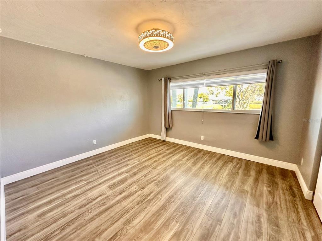 2431 Canadian Way, Unit 37 Clearwater, FL 33763 - Photo 22 of 46 a view of an empty room and window